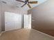 Bedroom boasts carpet, sliding closet doors, a ceiling fan and is freshly painted at 3455 Pegaso Ave, New Smyrna Beach, FL 32168
