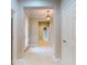 Bright entryway featuring tile floors, a decorative front door, and neutral wall colors at 3455 Pegaso Ave, New Smyrna Beach, FL 32168