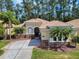 Charming single-story home featuring well-manicured landscaping and a spacious driveway at 3455 Pegaso Ave, New Smyrna Beach, FL 32168