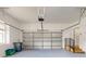 Large garage with sealed concrete flooring, a garage door opener and storage at 3455 Pegaso Ave, New Smyrna Beach, FL 32168