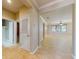 Open-concept living space with tile flooring, neutral walls, and ample natural light from large windows at 3455 Pegaso Ave, New Smyrna Beach, FL 32168