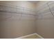 Walk-in closet is equipped with wire shelving providing ample storage solutions at 3455 Pegaso Ave, New Smyrna Beach, FL 32168
