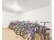 Well-lit bike storage area featuring a row of bikes neatly lined up against a white wall at 3606 S Peninsula Dr # 812, Port Orange, FL 32127