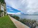 Well-maintained walkway bordering lush lawns by the intercoastal waterway at 3606 S Peninsula Dr # 812, Port Orange, FL 32127