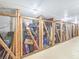 Indoor storage locker area featuring multiple caged lockers with items stored inside for resident use at 3606 S Peninsula Dr # 812, Port Orange, FL 32127