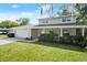 Charming two-story home with stone accents, attached garage, and a well-kept front lawn at 3644 Dame St, Port Orange, FL 32129