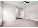 Bright, airy bedroom with neutral carpet, a ceiling fan, and a walk-in closet at 377 Palm Dr, New Smyrna Beach, FL 32168