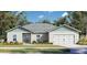 Charming single-story home with a two-car garage, manicured lawn, and beautiful landscaping at 377 Palm Dr, New Smyrna Beach, FL 32168