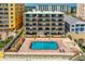 Beachfront condo building featuring a pool, balcony views, and easy beach access at 3807 S Atlantic Ave # 302, Daytona Beach Shores, FL 32118
