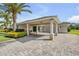 Charming single-story home featuring a covered entrance with stately columns and a brick paver driveway at 4177 Mayfair Ln, Port Orange, FL 32129