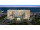 Multi-story condominium with a well-maintained exterior and beautiful landscaping near the ocean at 4651 S Atlantic Ave # 7060, Port Orange, FL 32127