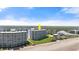 Charming beachfront condominium building nestled amidst lush greenery and pristine sandy shores at 5201 S Atlantic Ave # 708A, New Smyrna Beach, FL 32169