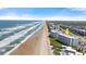 Stunning oceanfront condo building with easy beach access, surrounded by lush greenery at 5201 S Atlantic Ave # 708A, New Smyrna Beach, FL 32169