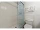Bathroom offers a walk-in shower, toilet, and tiled walls at 5201 S Atlantic Ave # 708A, New Smyrna Beach, FL 32169