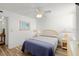 Bedroom featuring wood-look floors, a bed, and neutral colored walls at 5201 S Atlantic Ave # 708A, New Smyrna Beach, FL 32169