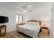 Bright bedroom features fan and ocean-themed bedding at 5201 S Atlantic Ave # 708A, New Smyrna Beach, FL 32169
