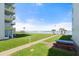 Oceanfront condo with grassy area, picnic tables, and easy beach access at 5201 S Atlantic Ave # 708A, New Smyrna Beach, FL 32169