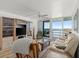 Inviting living room with ocean view, comfortable seating, and a media center at 5201 S Atlantic Ave # 708A, New Smyrna Beach, FL 32169
