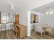 Bright living room area with furniture, desk, and sliding glass doors leading to ocean view at 5201 S Atlantic Ave # 708A, New Smyrna Beach, FL 32169