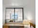 Bright living space features a desk, large window with ocean view, and neutral decor at 5201 S Atlantic Ave # 708A, New Smyrna Beach, FL 32169