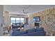 Comfortable living room features floor to ceiling windows and a stone fireplace at 5499 Atlantic # 104, New Smyrna Beach, FL 32169