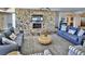 Inviting lobby featuring comfortable seating and a stone fireplace at 5499 Atlantic # 104, New Smyrna Beach, FL 32169