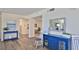 Inviting lobby featuring elegant decor, blue accents, and wood-look floors at 5499 Atlantic # 104, New Smyrna Beach, FL 32169