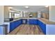 Recreation area offering ample counter space with blue cabinets and wood-look flooring at 5499 Atlantic # 104, New Smyrna Beach, FL 32169