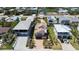 Stunning aerial view of a coastal home with well-maintained landscaping and proximity to the beach at 6260 S Atlantic Ave, New Smyrna Beach, FL 32169