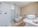 Modern bathroom featuring a freestanding tub, glass-enclosed shower, and vessel sink at 6260 S Atlantic Ave, New Smyrna Beach, FL 32169