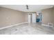 Large, empty bedroom with tile floors and doorways leading to the bathroom and closet space at 6260 S Atlantic Ave, New Smyrna Beach, FL 32169