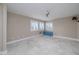 Bright, expansive bedroom with plantation shutters and built in blue cabinet at 6260 S Atlantic Ave, New Smyrna Beach, FL 32169