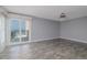 Bedroom with a ceiling fan and slider doors leading to a balcony with an ocean view at 6260 S Atlantic Ave, New Smyrna Beach, FL 32169