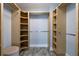 Custom walk-in closet with wood shelving and ample storage space at 6260 S Atlantic Ave, New Smyrna Beach, FL 32169