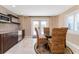 Cozy dining area with wet bar featuring stainless steel appliances and direct access to the outdoors at 6260 S Atlantic Ave, New Smyrna Beach, FL 32169