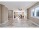 A dining room with a window, shutter and tile flooring, and a small wet bar area at 6260 S Atlantic Ave, New Smyrna Beach, FL 32169