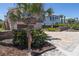 Exterior showcasing a driveway, landscaping, and a uniquely designed mailbox with a seahorse at 6260 S Atlantic Ave, New Smyrna Beach, FL 32169