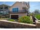 Two-story house with balconies, a garage, and a well-maintained garden at 6260 S Atlantic Ave, New Smyrna Beach, FL 32169