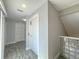 Upstairs hallway showing an elevator with tiled floors and ample lighting at 6260 S Atlantic Ave, New Smyrna Beach, FL 32169
