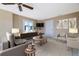 Comfortable living room featuring neutral decor, a ceiling fan, and cozy seating at 6260 S Atlantic Ave, New Smyrna Beach, FL 32169