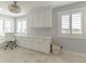 Well-lit office space with built-in cabinets and views from the window, creating a functional workspace at 6260 S Atlantic Ave, New Smyrna Beach, FL 32169