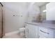 Bathroom featuring a white vanity with gray countertop and tiled shower at 6277 W Fallsgrove Ln, Port Orange, FL 32128