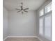 Bright bedroom features neutral walls, a ceiling fan, two windows, and shutter blinds at 6277 W Fallsgrove Ln, Port Orange, FL 32128