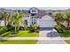 Charming one-story home boasts beautiful landscaping, brick driveway, and a two-car garage at 6277 W Fallsgrove Ln, Port Orange, FL 32128