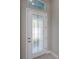 Elegant front door with decorative glass detailing welcomes you home at 6277 W Fallsgrove Ln, Port Orange, FL 32128