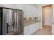 Kitchen with stainless steel refrigerator and white cabinets at 6277 W Fallsgrove Ln, Port Orange, FL 32128