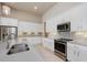 Modern kitchen featuring stainless appliances and a stylish backsplash at 6277 W Fallsgrove Ln, Port Orange, FL 32128
