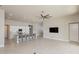Open-concept living room and kitchen area with recessed lighting at 6277 W Fallsgrove Ln, Port Orange, FL 32128