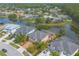 An aerial view of the community with lovely homes situated along a winding lake at 6950 Vintage Ln, Port Orange, FL 32128