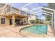Screened pool with patio and spa, perfect for outdoor relaxation and entertainment at 6950 Vintage Ln, Port Orange, FL 32128